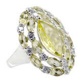 Lourdes yellow gemstone abstract ring with marquise center stone and sparkling white accents in silver setting