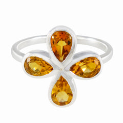 Ying yellow gemstone floral ring with four pear-shaped yellow gemstones set in silver band