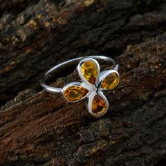 Ying yellow gemstone floral ring with four teardrop-shaped yellow stones set in silver band