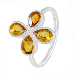 Ying yellow gemstone floral ring with four pear-shaped yellow stones set in silver band