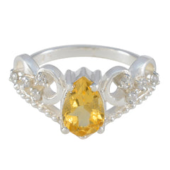 Olivia yellow gemstone halo ring with pear-shaped center stone and silver band detailing