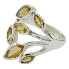 Milagros yellow gemstone leafy ring with marquise-cut stones set in a silver band