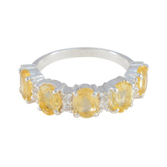 Stella yellow gemstone ring with five oval yellow stones and small diamond accents on silver band