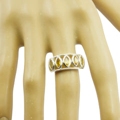 Natalie yellow gemstone ring with multiple marquise-cut stones set in silver band on finger