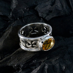 Emily silver ring featuring a yellow gemstone solitaire ring with intricate cut-out design