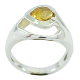 Lea yellow gemstone solitaire ring with a pear-shaped yellow stone set in polished silver band