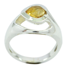 Lea yellow gemstone solitaire ring with a pear-shaped yellow stone set in polished silver band