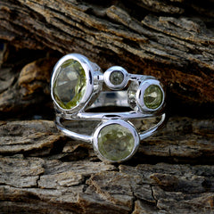 Julia silver multi stone yellow gemstone statement ring with bezel set pale yellow stones on wood