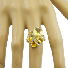 Yasmin yellow gemstone statement ring with three faceted yellow stones in silver setting on mannequin hand