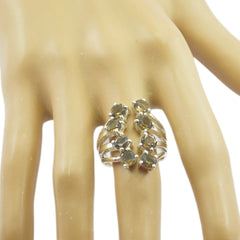 Lara yellow gemstone statement ring with multiple yellow stones on silver band worn on hand