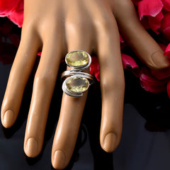 Ellie yellow gemstone toi et moi ring with two oval yellow stones on silver band displayed on hand