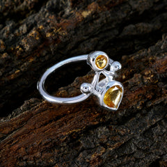 Rosa yellow gemstone toi et moi ring with silver band featuring round and pear-shaped yellow stones