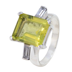 Mila yellow gemstone trilogy ring with a rectangular yellow stone and two clear baguette side stones