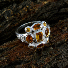 Ananya yellow navratna ring with multiple yellow gemstones set in intricate silver band design