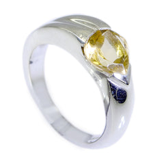 Lucy yellow solitaire engagement ring with pear-shaped yellow gemstone on silver band
