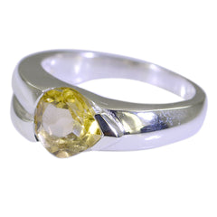 Lucy yellow solitaire engagement ring with a heart-shaped yellow gemstone on a silver band