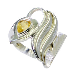 Nella yellow solitaire ring for wedding with unique silver and gold swirl design