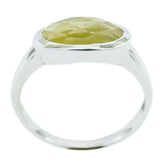 Sakura yellow solitaire ring with faceted oval yellow gemstone in bezel sterling silver band