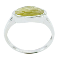 Sakura yellow solitaire ring with faceted oval yellow gemstone in bezel sterling silver band