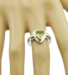 Siti yellow solitaire ring with triangular yellow gemstone set in silver band on mannequin hand