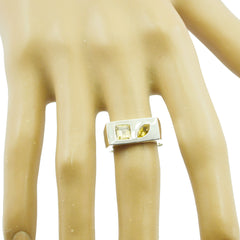 Teresa yellow toi et moi ring with two yellow gemstones on a silver band worn on a finger