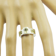Emily yellow trilogy gemstone ring with three rectangular yellow stones set in silver band on hand