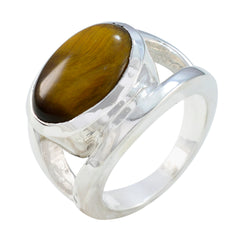 Eva artisan brown solitaire ring with polished silver band and oval brown stone centerpiece