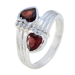 Daniela silver ring featuring two heart-shaped red gemstones and small clear stones abstract red gemstone ring