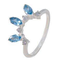 Josephine blue crown trilogy ring with three blue marquise gemstones and small clear stones on silver band
