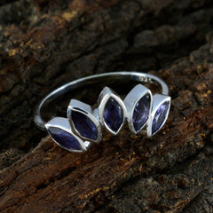 Claire silver ring featuring a blue gemstone crown ring design with five marquise-cut stones on textured bark