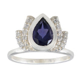 Dewi silver ring with a pear-shaped blue gemstone halo ring design featuring small clear stones