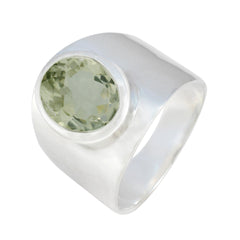 Angel light green solitaire ring with a wide silver band and round faceted gemstone