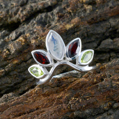 Nari multicolor gemstone crown ring with marquise-cut stones in silver setting on natural wood