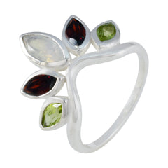Nari multicolor gemstone crown ring with red, green, and white gemstones set in silver