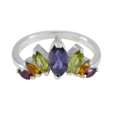 Min-seo multicolor gemstone crown ring with purple, green, orange, and red stones set in silver band