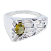 Nella multicolor gemstone solitaire ring with textured silver band and oval green gemstone