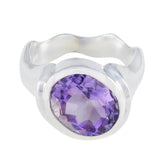 Penelope purple solitaire gemstone ring with a large oval purple gemstone set in silver band