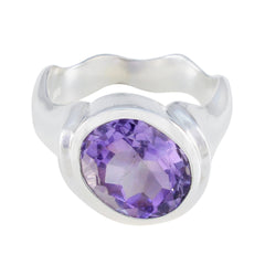 Penelope purple solitaire gemstone ring with a large oval purple gemstone set in silver band