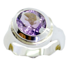 Penelope purple solitaire gemstone ring with a faceted oval purple stone set in a silver band