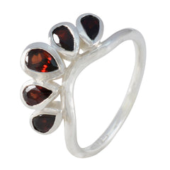Evelyn romantic red gemstone ring featuring five teardrop-shaped red stones in silver setting