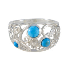Meera silver ring with intricate floral design and three blue stones turquoise trilogy ring