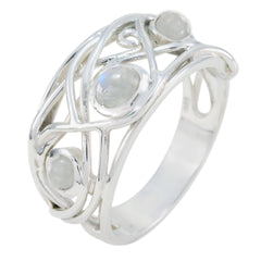 Laura white trilogy ring with three round white stones set in an intricate silver band design