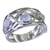 Laura white trilogy ring with intricate silver band and three round white stones