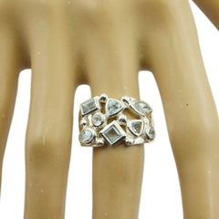 Meera silver band with mixed cut light blue stones trendy blue gemstone ring displayed on mannequin hand