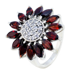 Ella abstract red gemstone ring with marquise garnet petals and central pave diamond cluster on silver band