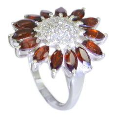 Ella abstract red gemstone ring with marquise garnet petals and pave diamond center on silver band