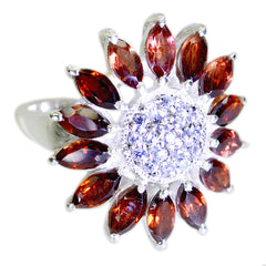 Ella abstract red gemstone ring with marquise red stones radiating like flower and pave clear center on silver band