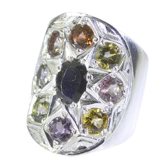 Liyana Navratna gemstone ring silver statement ring with central dark sapphire and eight surrounding multicolored gems