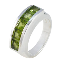 Rebeca silver band with channel set peridot stones green gemstone contemporary ring for everyday wear