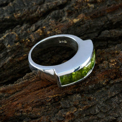 Rebeca sterling silver green gemstone contemporary ring with channel set peridot stones and polished band